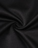 A close-up of black sustainable poly/cotton fabric, showcasing a smooth and sleek texture.