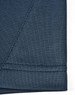 A close-up of a dark blue polo shirt fabric showing the seam detail and texture, featuring a logo.