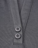 A close-up of a grey polo shirt featuring a placket with two black buttons and a sustainable fabric blend.