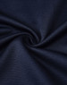 A close-up of navy blue sustainable poly/cotton fabric, showcasing its smooth texture and weave pattern.