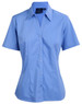 A light blue short sleeve button-up shirt with a fitted design and a branded label.