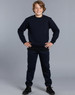 A kids' crew neck fleecy sweater in navy, worn with matching navy pants, featuring a logo on the garment.