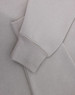 A light grey polar fleece jumper featuring a half zip collar and fitted cuffs. It has a subtle logo.