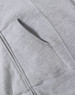 A grey ladies' full-zip fleecy hoodie featuring a front pocket and soft fabric texture. The hoodie has a branding logo.