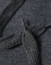 A close-up of a dark grey fleece hoodie showing the texture of the fabric and a knitted drawstring.