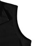 A black softshell hi-tech vest with a close-up view of the collar and zip detail, featuring a logo.