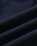 A navy blue softshell fabric displaying smooth, folded sections, featuring a logo. Suitable for a full zip hoodie.