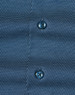 Men's long-sleeve button-up shirt in navy with a pin dot pattern and contrasting buttons. Features branding.