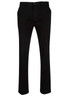 Men's chino pants in black, featuring a classic cut and subtle branding on the waistband.