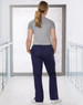 Ladies' solid colour scrub pants in navy, featuring a relaxed fit and elastic waistband, captured from the back.