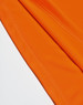 An orange AIWX Vented Cooldry Polo with visible stitching details, featuring a branding logo.