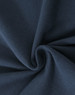 A close-up of navy cotton fabric with a stretch texture, showcasing its softness and weave.
