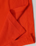 An orange Men's Truedry Pique Polo shirt, highlighting the fabric texture and seams. It features a logo.
