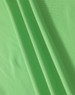 A close-up of soft, textured fabric in vibrant green, showcasing the material of a polo shirt.