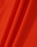An orange fabric with a textured surface, showcasing the material of the Ladies' Truedry Pique Polo.