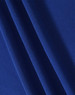 A close-up of textured fabric in a rich blue colour, featuring multiple folds for visual interest.