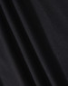 A close-up of black fabric showcasing the texture of a polo shirt. The material appears smooth and lightweight.