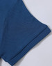 A close-up of a blue polo shirt sleeve, showcasing the textured fabric and stitched details. The shirt has a logo.