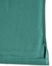 A close-up view of a teal men's bamboo charcoal polo shirt, featuring a hem with side splits and a logo.