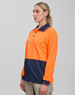 A high-visibility long-sleeve polo shirt in orange and navy blue, featuring a logo and a chest pocket.