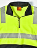 A high-visibility jumper in fluorescent yellow and black, featuring reflective stripes and a zippered collar.
