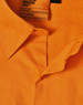 An orange safety shirt featuring a collar and mesh detailing, with a tag indicating industrial wear.