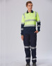 A long-sleeved safety polo in neon yellow and navy, featuring reflective stripes and a logo. Suitable for workwear.
