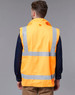 A reversible safety vest in bright orange with reflective stripes, viewed from the back. It has a logo on the fabric.
