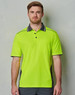 A high-visibility lime green polo shirt with grey accents and a chest pocket, featuring a logo on the front.