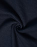 A close-up of dark navy fabric with a smooth, soft texture, showcasing a poly/cotton blend.