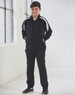 A black kids' warm-up jacket with white accents, paired with matching black pants. The model stands with hands in pockets.