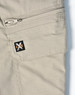 A close-up of light khaki work pants featuring a zippered pocket and a small logo on the side.