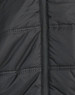 A close-up of a black, unisex sustainable parka jacket featuring a seamless design and zip closure.
