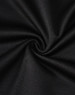 A close-up of black fabric with a smooth texture, showcasing the sustainable poly/cotton blend.