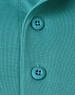 A close-up of a teal men's polo shirt, featuring buttons and a textured fabric.