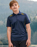 A boy stands outdoors wearing a navy polo shirt with yellow accents and a logo. The background features trees and hills.