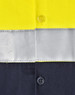 A high-visibility long-sleeve safety shirt featuring yellow fabric with grey reflective tape and dark navy sections.