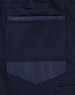 A navy blue fabric with a pocket detail, part of the unisex cotton stretch cuffed work pants.