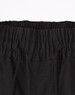 A close-up of unisex cotton stretch drill cuffed work pants in black, featuring an elastic waistband and drawstring.
