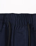 A close-up of navy blue unisex work shorts, featuring an elastic waistband and drawstring with pockets.