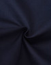 A close-up view of dark blue cotton fabric, showing its smooth texture and stretch quality.