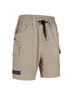 Unisex cotton stretch drill shorts in beige with pockets and an elastic waistband. Features branding.
