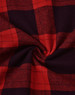 A close-up of a unisex flannel plaid shirt featuring a red and black pattern with a soft texture.