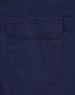 A navy long-sleeve work shirt featuring a closed front and a pocket on the back. The shirt has a branding logo.