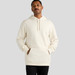 A cream-coloured hoodie with a front pocket and a drawstring hood, featuring a logo.