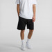 Black sports shorts with an elastic waistband and drawstring, featuring a branding logo. Black sports shorts with an elastic waistband and drawstring, featuring a branding logo.