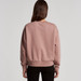 A back view of a pink jumper with a relaxed fit and ribbed cuffs, featuring a logo on the back. A back view of a pink jumper with a relaxed fit and ribbed cuffs, featuring a logo on the back.