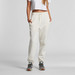 Track pants in cream, featuring a comfortable waistband and side pockets, paired with sporty footwear. Track pants in cream, featuring a comfortable waistband and side pockets, paired with sporty footwear.