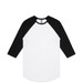 A Raglan Tee featuring a white body with black three-quarter sleeves and a round neckline. It has a brand logo. A Raglan Tee featuring a white body with black three-quarter sleeves and a round neckline. It has a brand logo.