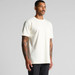 A plain cream Classic Pocket Tee featuring a front pocket and short sleeves, modelled by a person with tattoos. A plain cream Classic Pocket Tee featuring a front pocket and short sleeves, modelled by a person with tattoos.